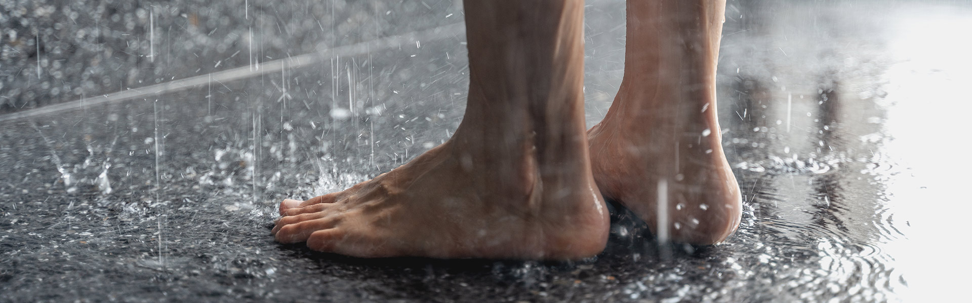 Foot of a person taking shower